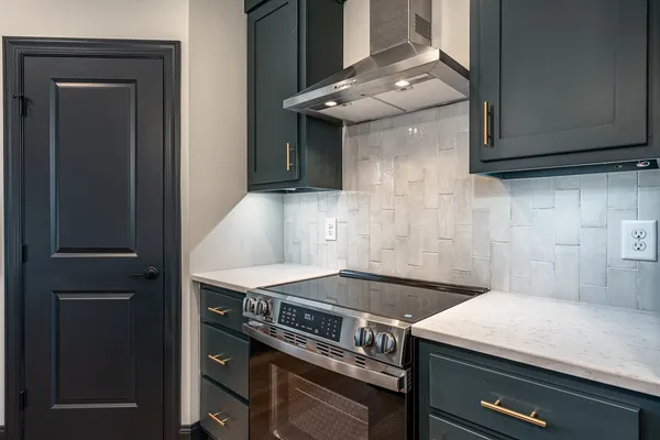 a kitchen with a stove and a microwave