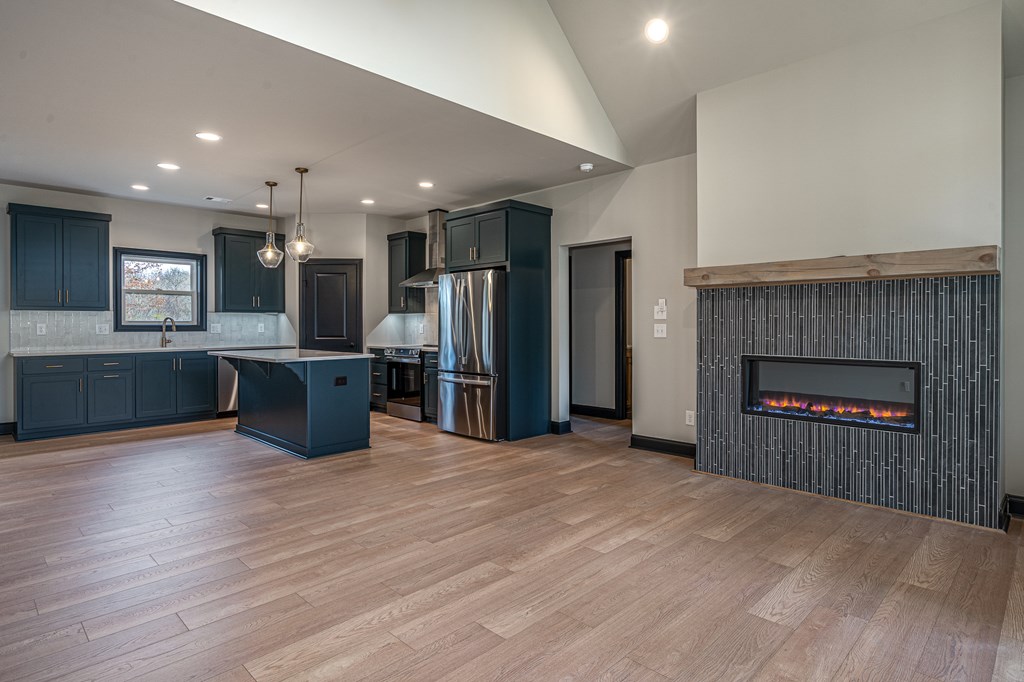 325 River Mountain Road Murphy, NC 28906 - Photo 17 of 57 a view of a kitchen with a sink and a fireplace