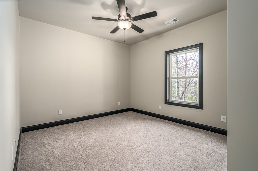 325 River Mountain Road Murphy, NC 28906 - Photo 30 of 57 an empty room with windows and fan