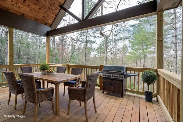 a view of wooden deck with a yard