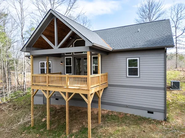 a view of house with outdoor space and garden
