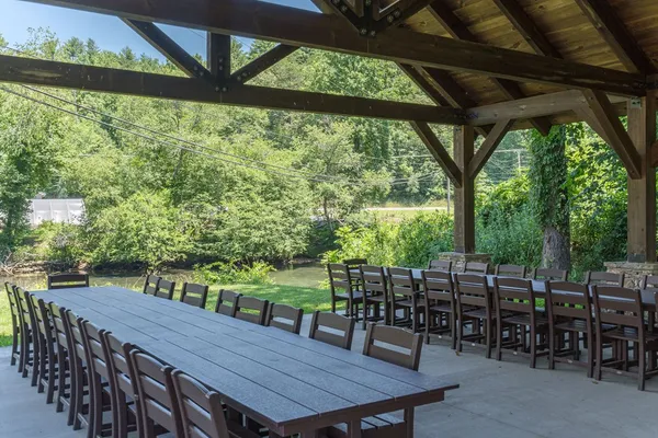 a dining room with furniture window and outside view
