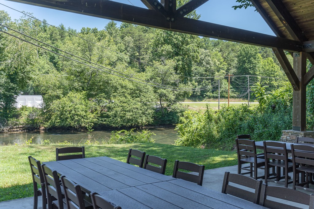 325 River Mountain Road Murphy, NC 28906 - Photo 50 of 57 a view of a chairs and table in patio with a yard