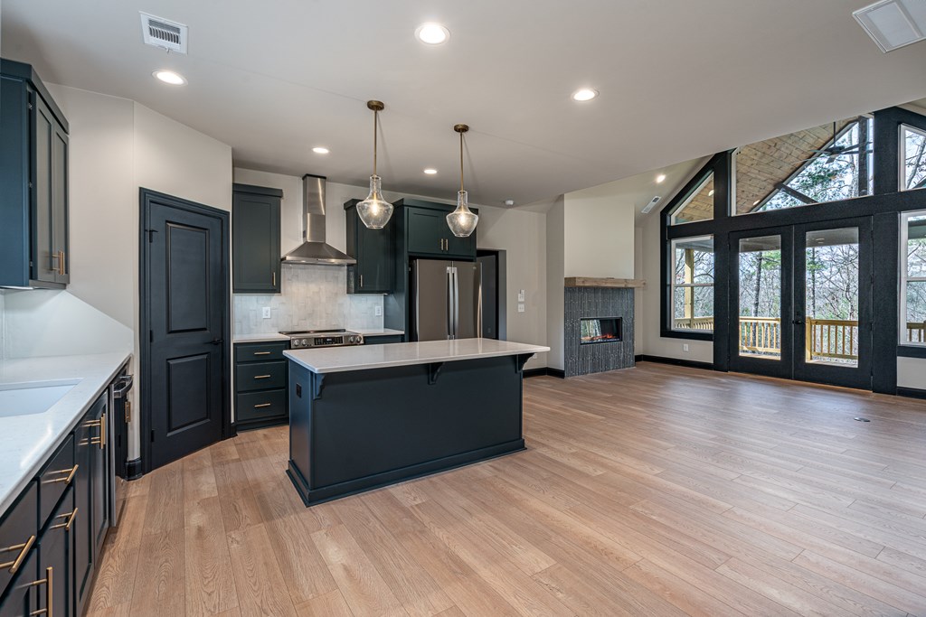 325 River Mountain Road Murphy, NC 28906 - Photo 5 of 57 a large kitchen with granite countertop a large counter top stainless steel appliances and a large window