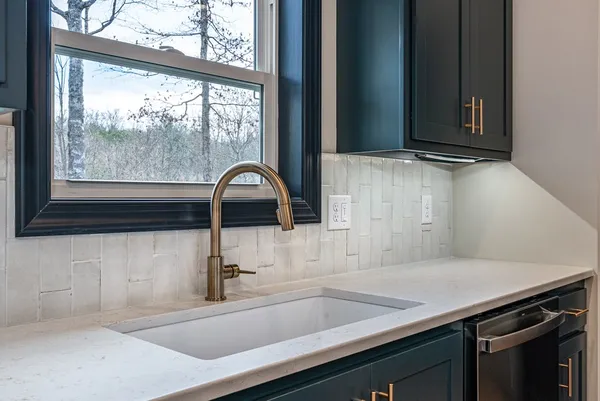 a kitchen with a sink and a window