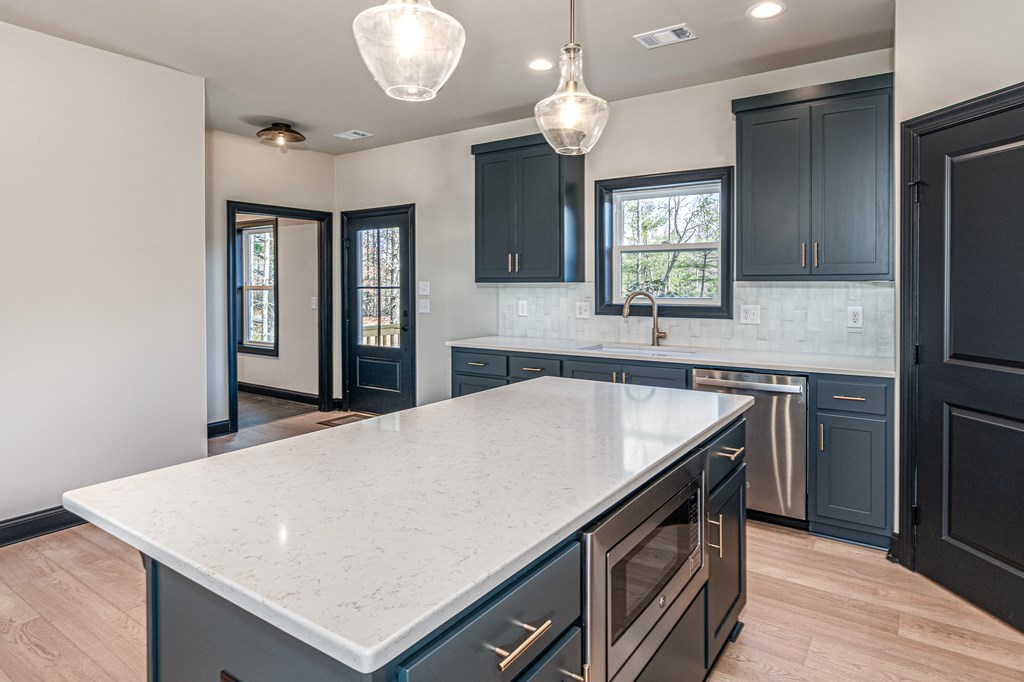 325 River Mountain Road Murphy, NC 28906 - Photo 9 of 57 a kitchen with a stove and a sink