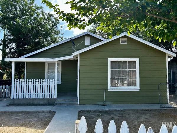 a front view of a house with garage
