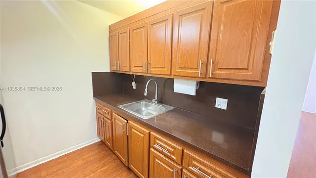 a kitchen with stainless steel appliances granite countertop a sink and dishwasher