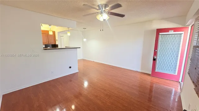 a view of a room with a large window