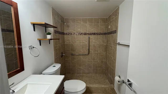 a bathroom with a toilet and shower