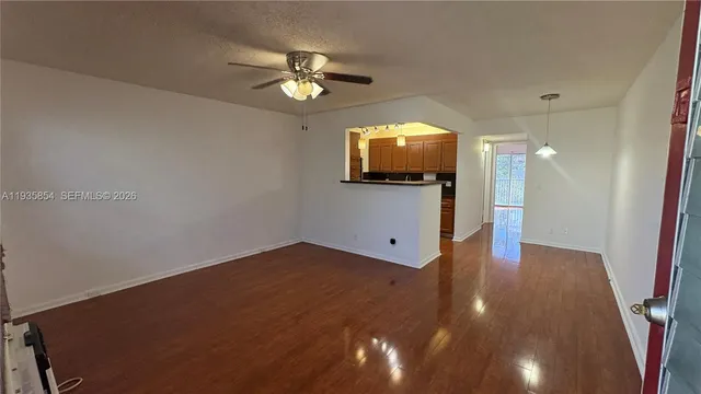 a view of a livingroom with wooden floor