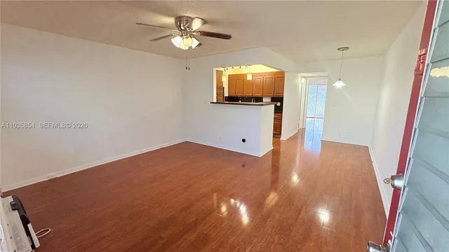 a view of a livingroom with wooden floor