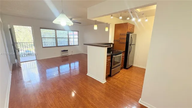 a view of a kitchen with furniture and a window
