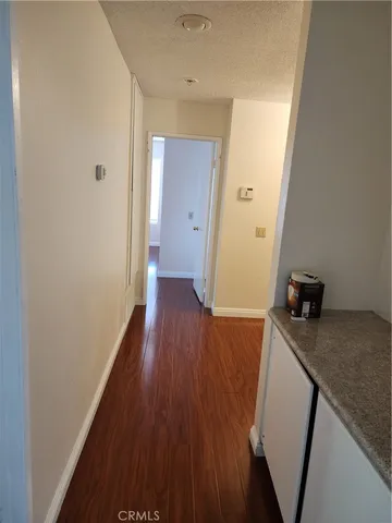 a view of a kitchen from the hallway