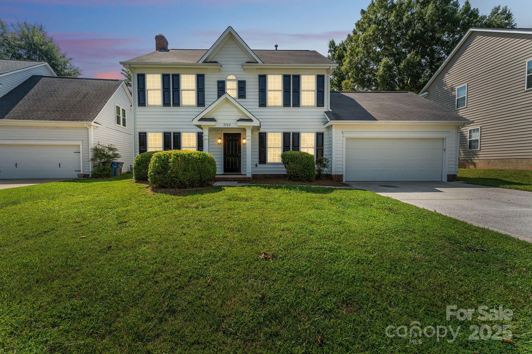 front view of a house with a yard