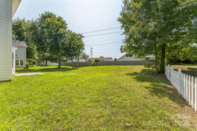 a view of a swimming pool with an outdoor space and seating area