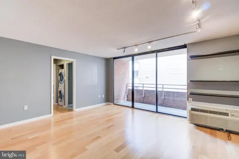 a view of an empty room with a window