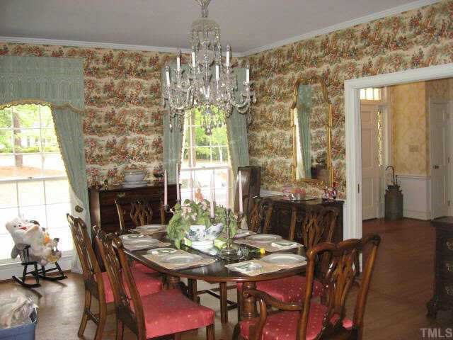 3306 Sussex Road Raleigh, NC 27612 - Photo 3 of 10 a view of a dining room with furniture window and outside view