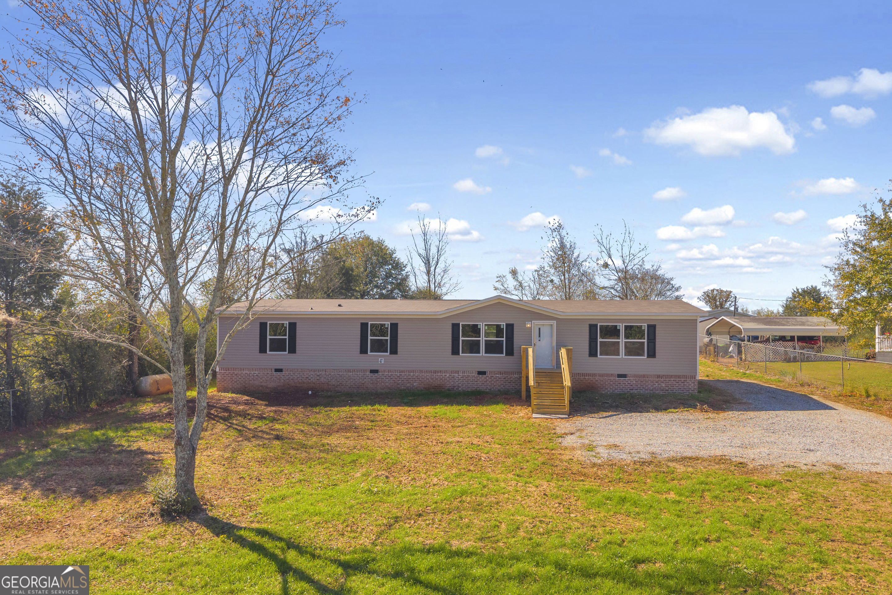 a view of house with swimming pool outdoor seating