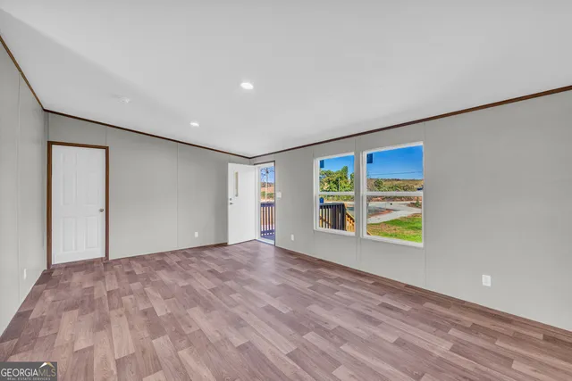 a view of a kitchen with a sink and a large window