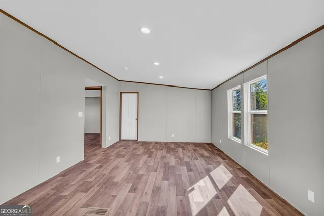 a view of a balcony with wooden floor