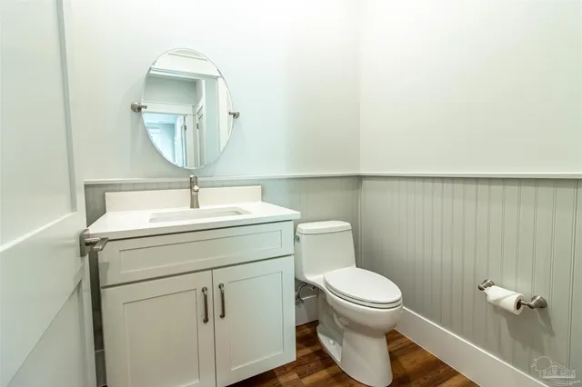 a white bath tub sitting next to a toilet