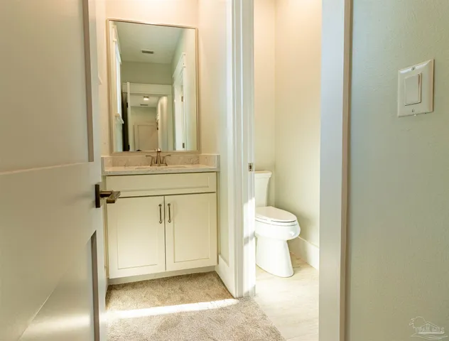 an empty room with windows and entrance