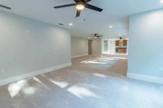 a view of a swimming pool with an outdoor seating