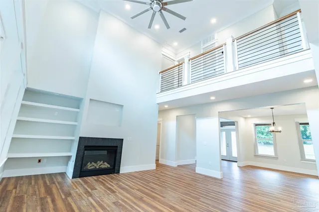 a kitchen with kitchen island a counter top space a sink stainless steel appliances and cabinets