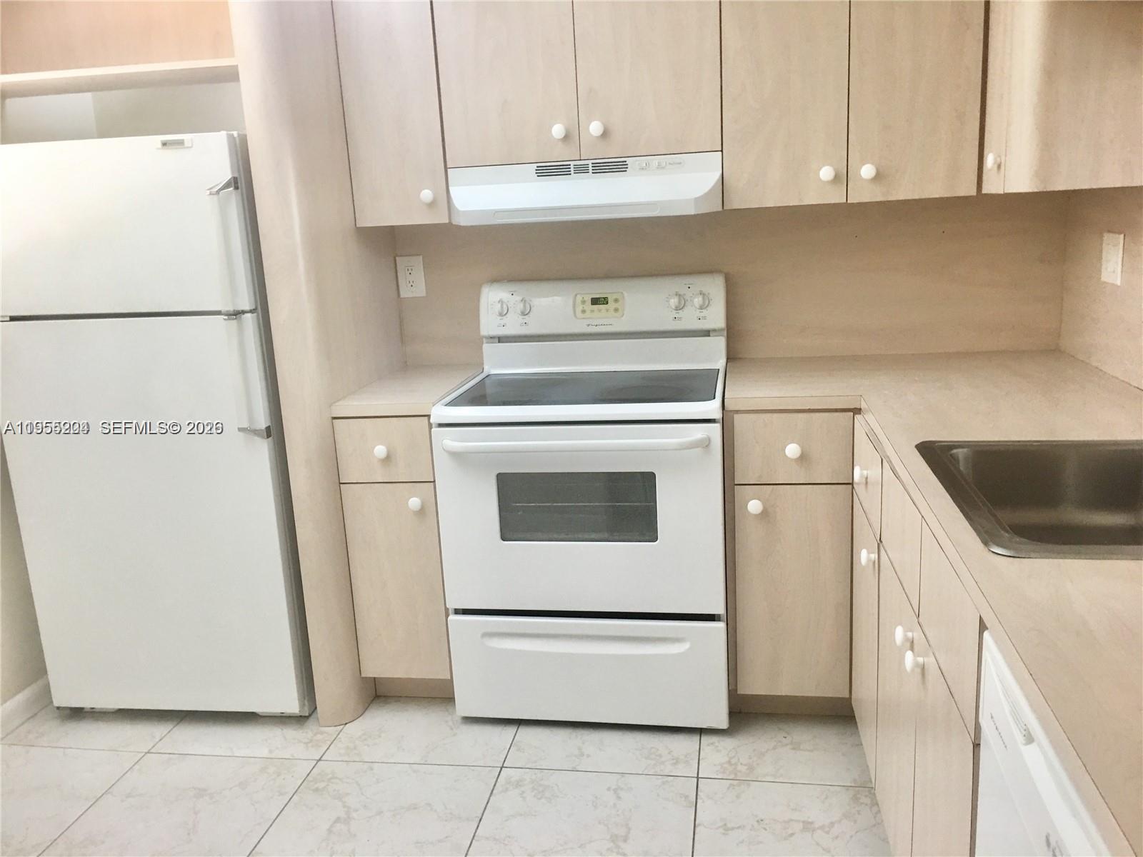 10875 Southwest 112th Avenue, Unit 104 Miami, FL 33176 - Photo 7 of 11 a utility room with dryer and washer