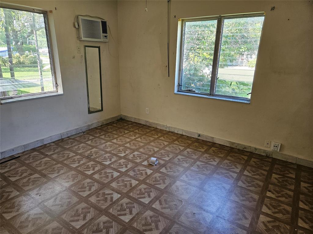 406 Southwest 10th Street Fort Lauderdale, FL 33315 - Photo 4 of 7 a view of an empty room with wooden floor and a window