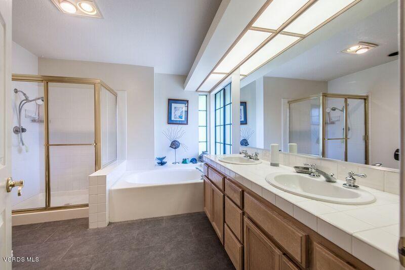 19620 Leadwell Street Reseda, CA 91335 - Photo 18 of 28 a spacious bathroom with a sink double vanity and a mirror