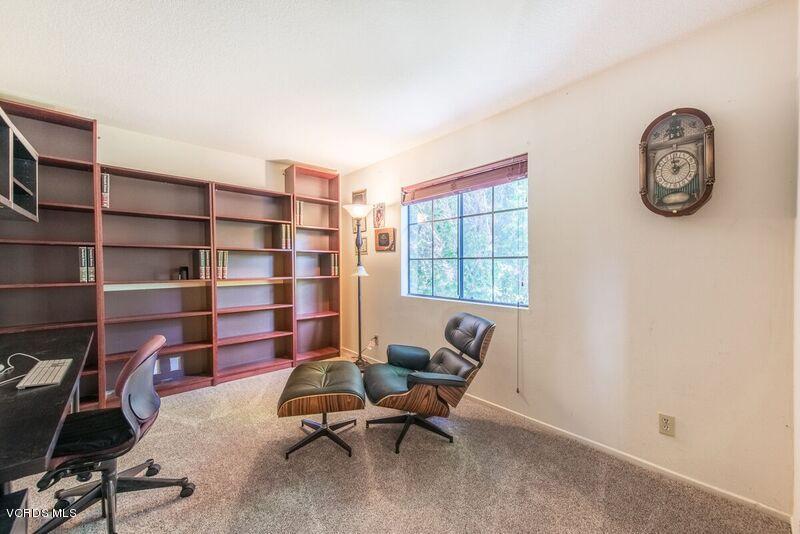19620 Leadwell Street Reseda, CA 91335 - Photo 20 of 28 a view of a workspace with a bookshelf