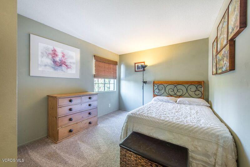 19620 Leadwell Street Reseda, CA 91335 - Photo 21 of 28 a bedroom with a bed and a painting on the wall