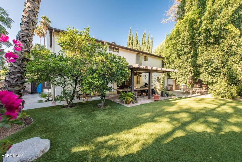 19620 Leadwell Street Reseda, CA 91335 - Photo 24 of 28 a view of a patio with table and chairs and potted plants