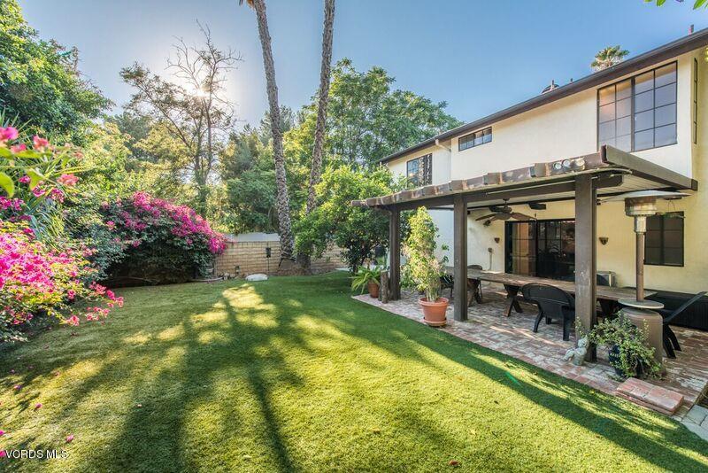 19620 Leadwell Street Reseda, CA 91335 - Photo 26 of 28 a view of a house with swimming pool lawn chairs and a yard
