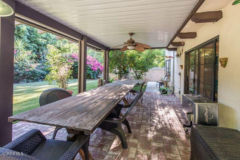 19620 Leadwell Street Reseda, CA 91335 - Photo 27 of 28 a view of a patio with table and chairs potted plants with floor to ceiling window
