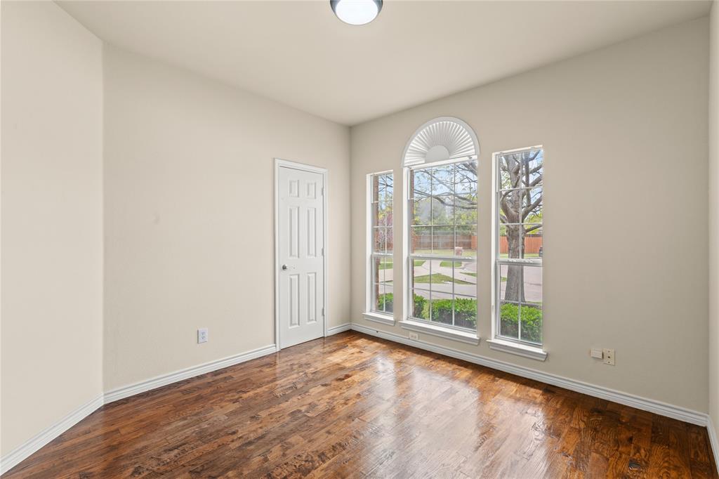 613 Windward Drive Murphy, TX 75094 - Photo 28 of 37 wooden floor in an empty room with a window