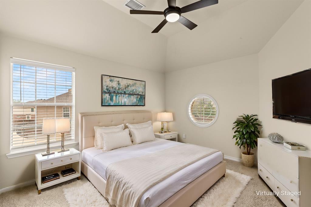613 Windward Drive Murphy, TX 75094 - Photo 31 of 37 a bedroom with a bed and a flat screen tv
