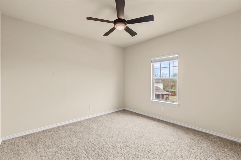 613 Windward Drive Murphy, TX 75094 - Photo 37 of 37 an empty room with windows and fan