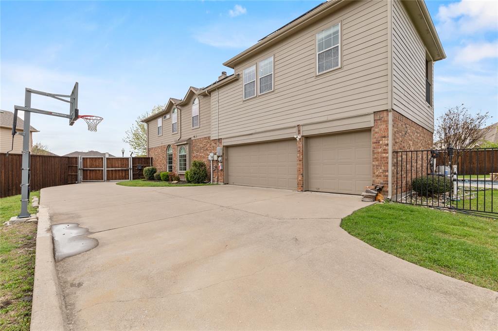613 Windward Drive Murphy, TX 75094 - Photo 7 of 37 a view of a house with a yard