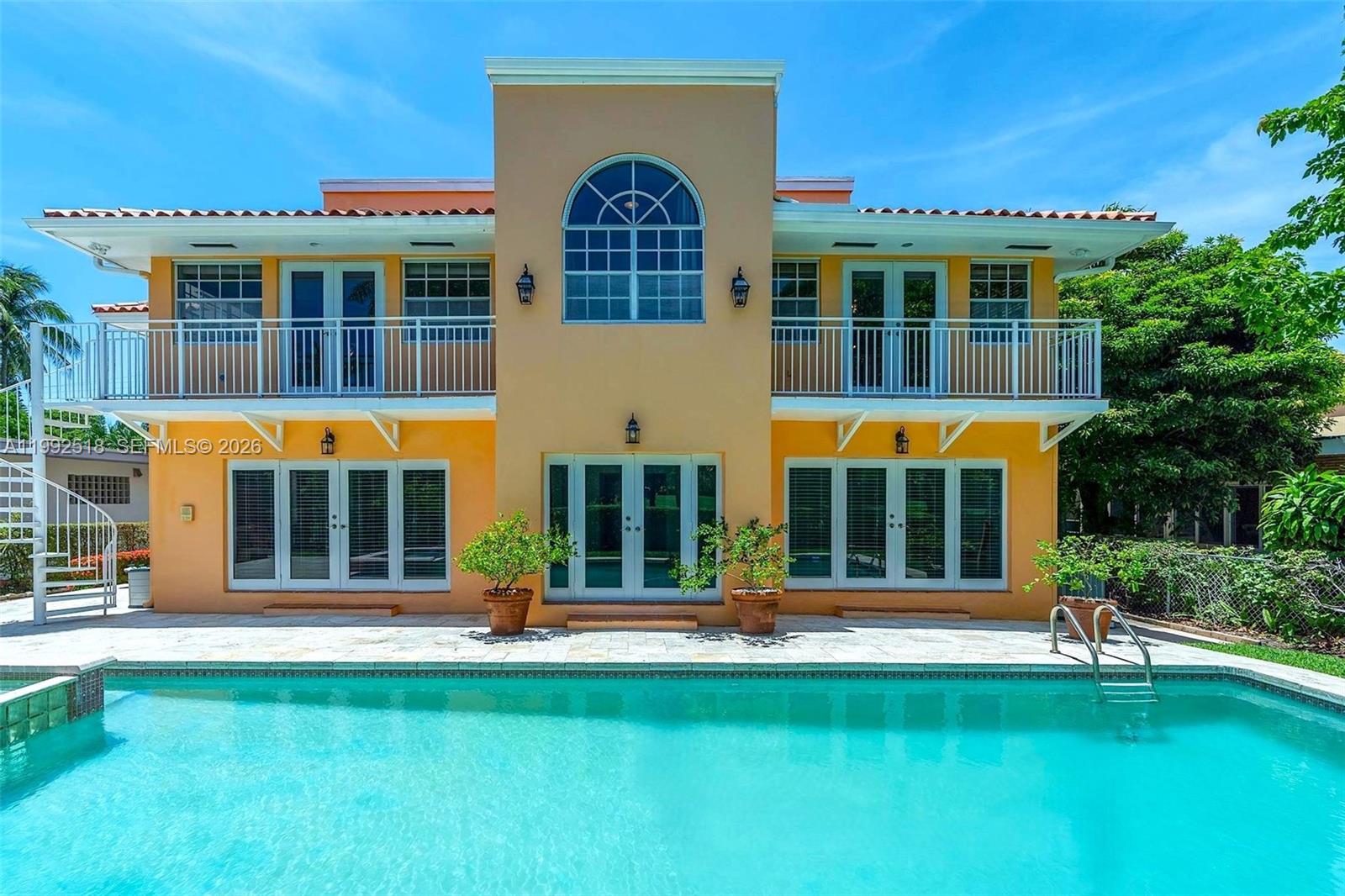 5309 Alton Road Miami Beach, FL 33140 - Photo 2 of 51 front view of a building with a yard