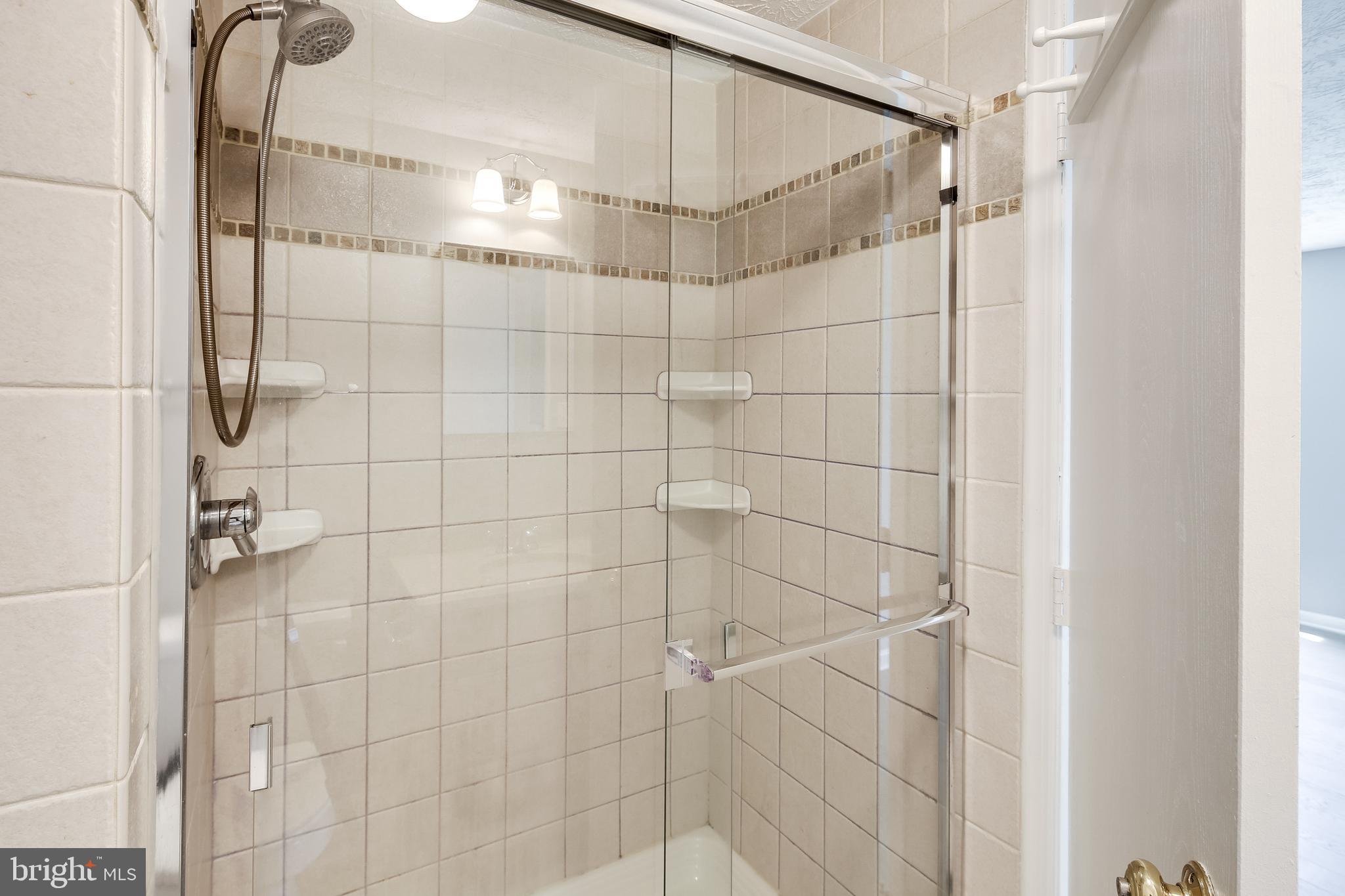 6375 Greenfield Road, Unit 1504 Elkridge, MD 21075 - Photo 17 of 27 Glass shower w/updated tile work