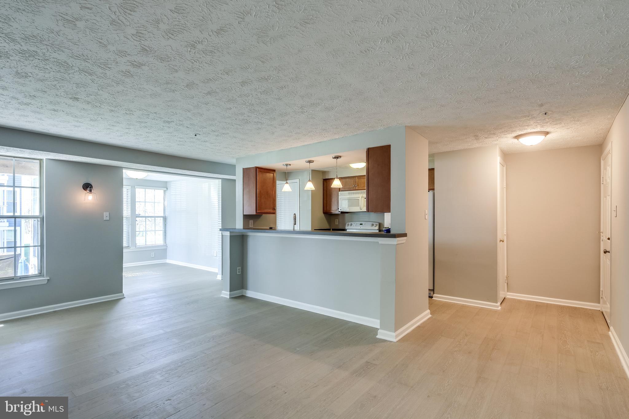 6375 Greenfield Road, Unit 1504 Elkridge, MD 21075 - Photo 3 of 27 Family room opens to kitchen