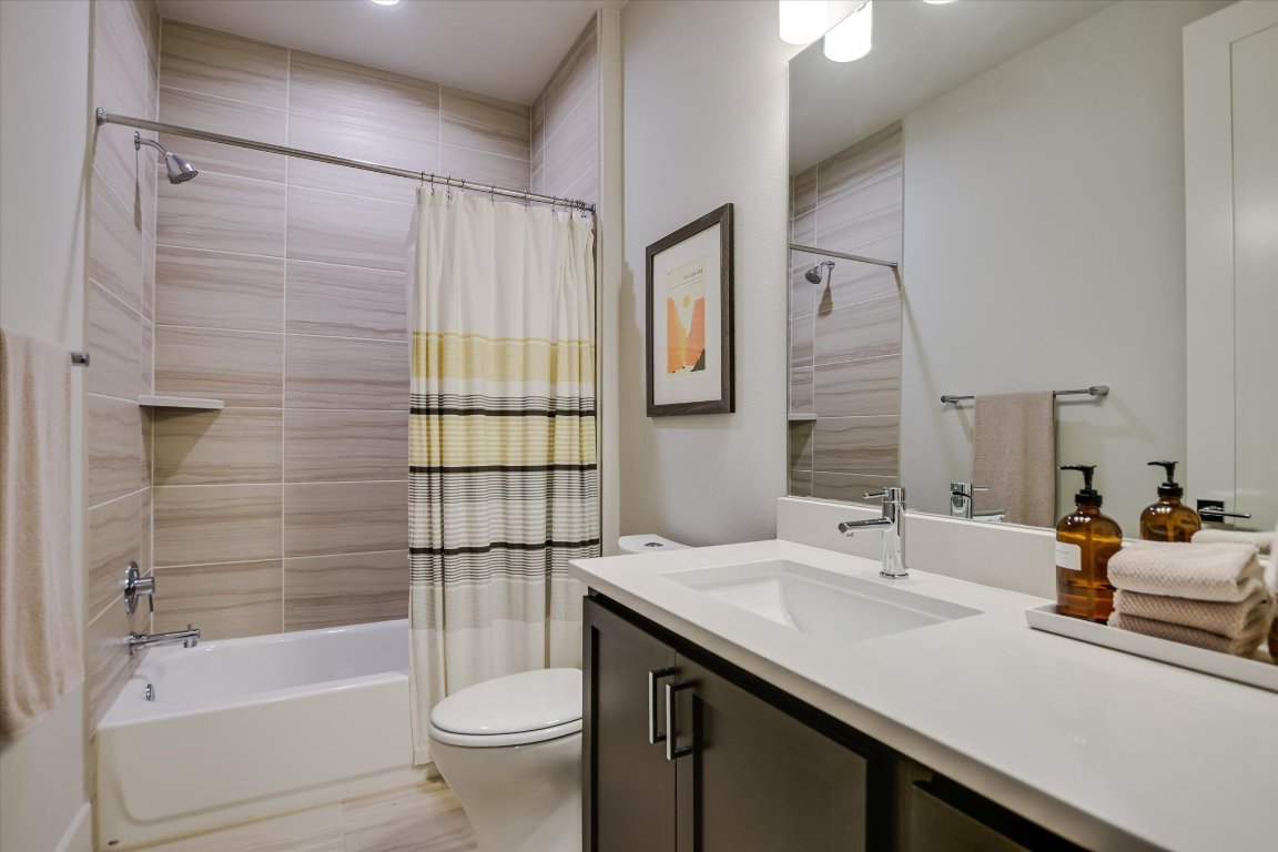 5212 Pink Poppy Pass, Unit 20 Austin, TX 78735 - Photo 15 of 24 Full bathroom featuring vanity and shower / bath combination with curtain