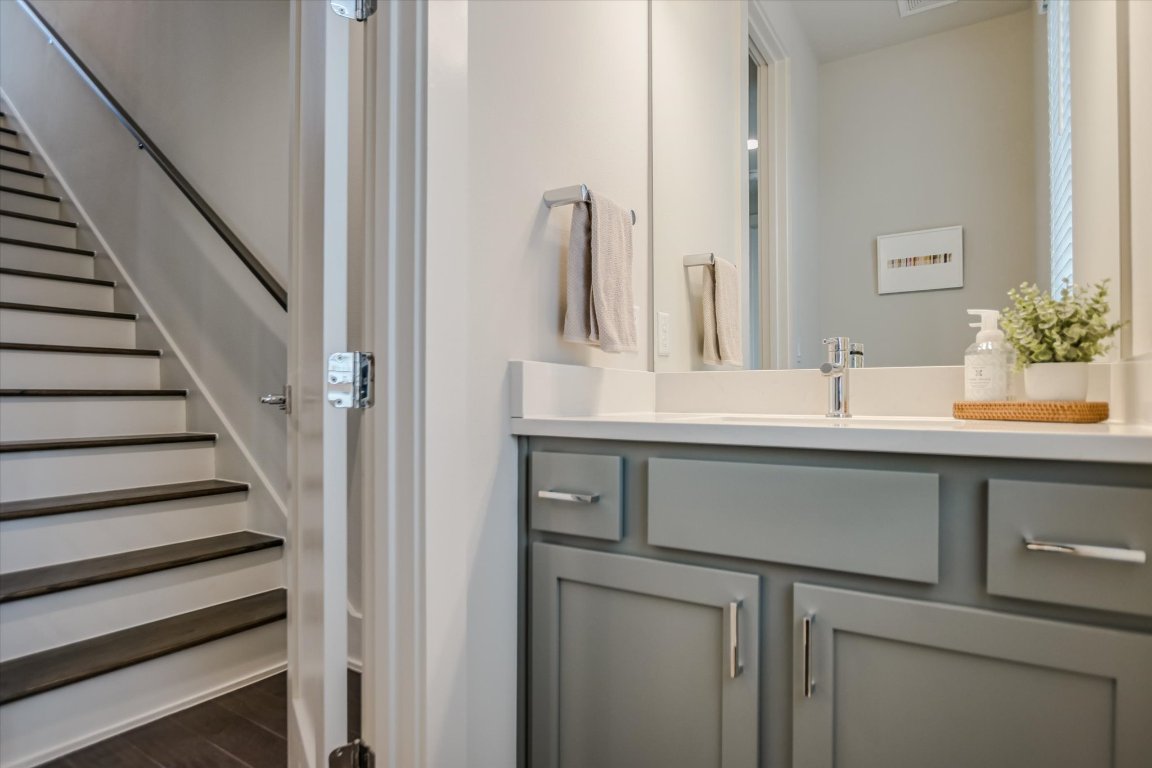 5212 Pink Poppy Pass, Unit 20 Austin, TX 78735 - Photo 17 of 24 Bathroom featuring vanity and dark wood-style floors