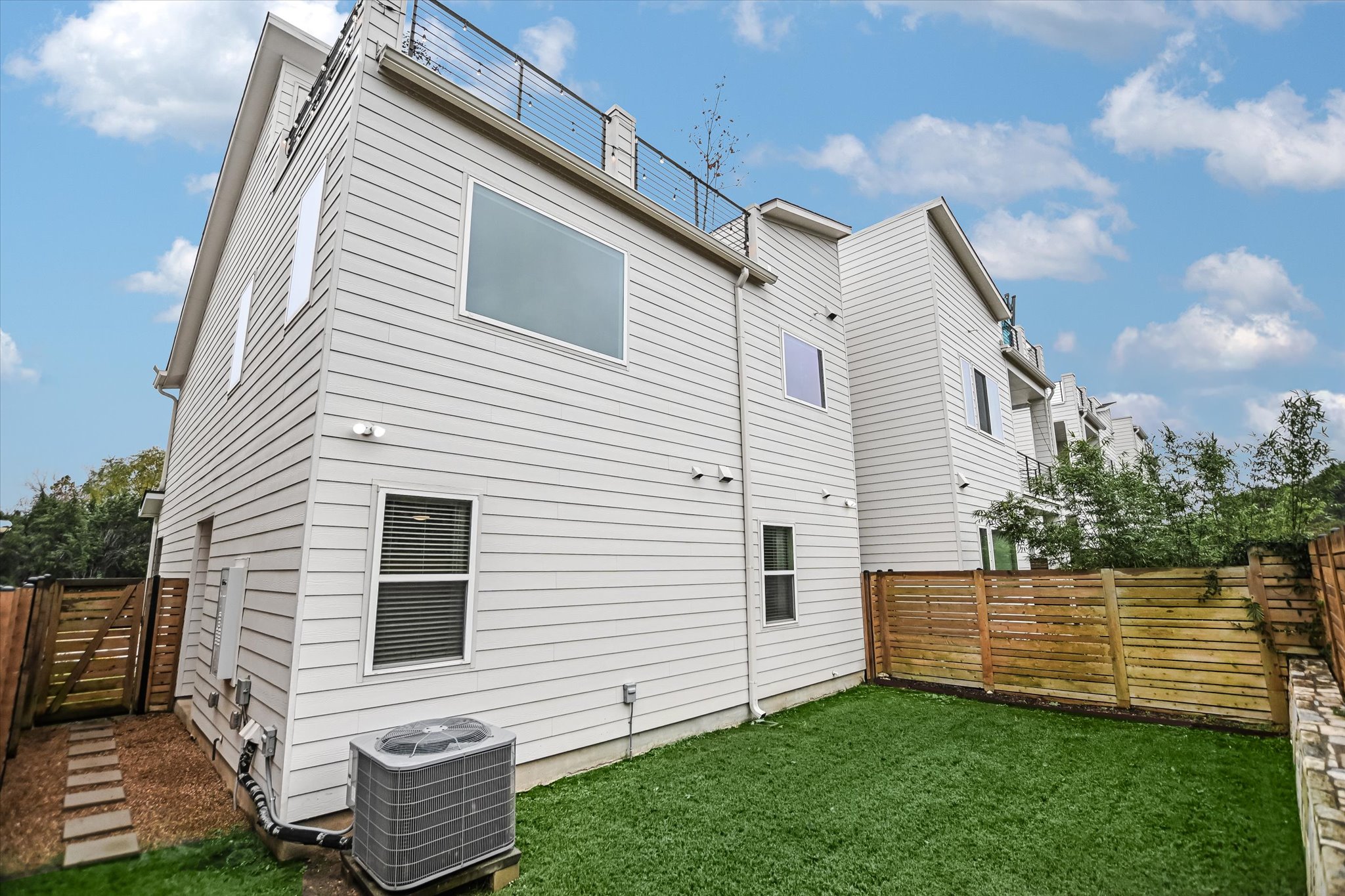 5212 Pink Poppy Pass, Unit 20 Austin, TX 78735 - Photo 22 of 24 Back of house with a fenced backyard