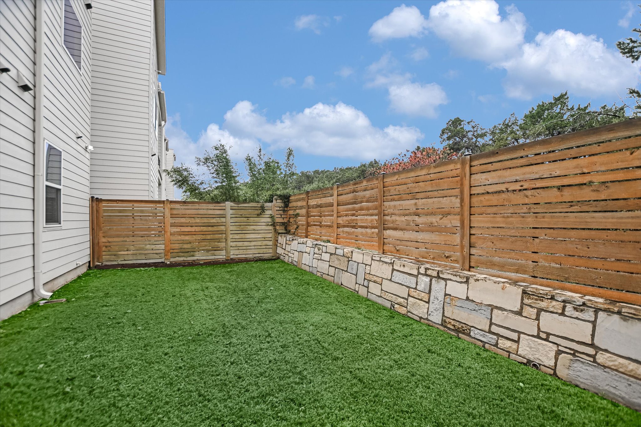5212 Pink Poppy Pass, Unit 20 Austin, TX 78735 - Photo 23 of 24 View of fenced backyard