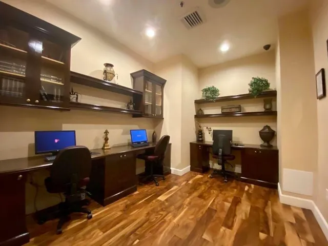 a kitchen with stainless steel appliances granite countertop a refrigerator and a stove