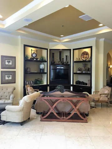 a bedroom with bed and a large window